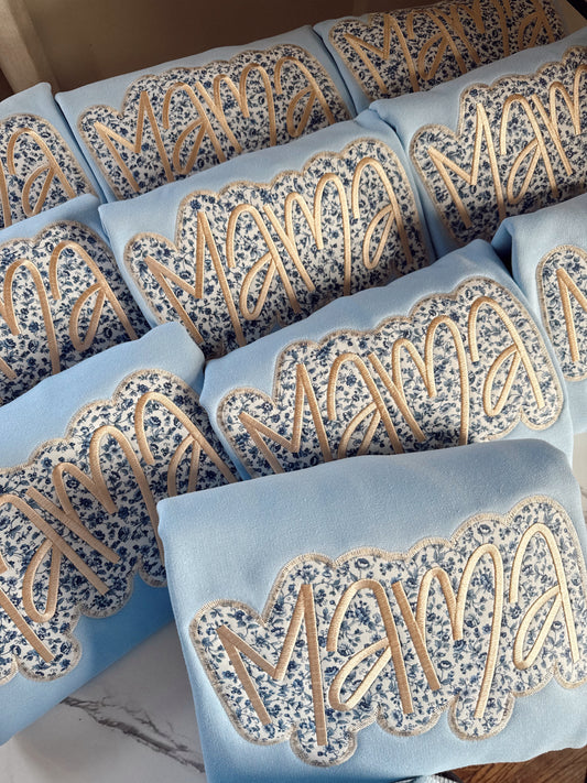 Embroidered blue floral mama